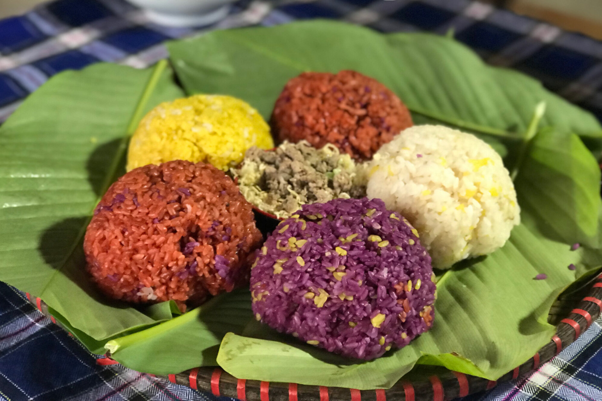 Colorful sticky rice with five hues served in a bamboo container